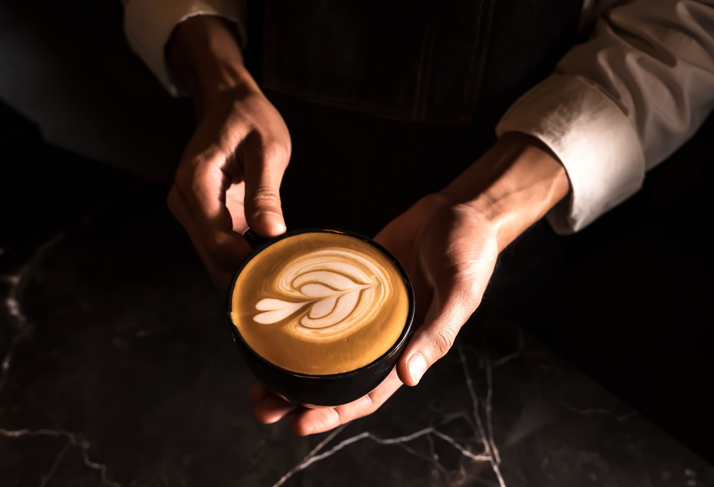 Barista presenting latte art